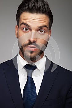 Businessman making big eyes because he is amazed and shocked