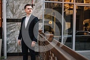 Young business man near of modern building.