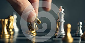 young business man playing chess