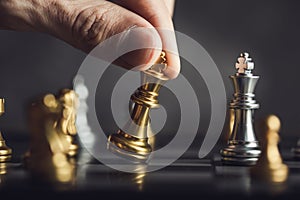 young business man playing chess