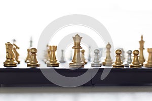 A young business man is playing chess, business strategy to be successful