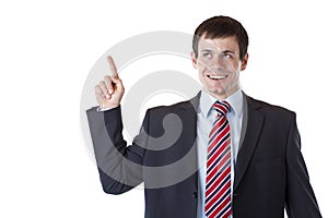 Young business man pointing at copyspace