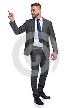 Young business man pointing finger at his back