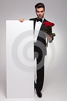 Young business man presenting a empty board