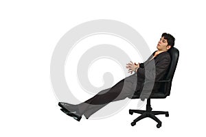 Young business man relaxing on a chair