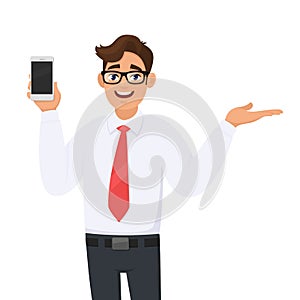 Young business man showing new brand, latest smartphone. Man holding cell, mobile phone in hand and gesturing/presenting hand palm