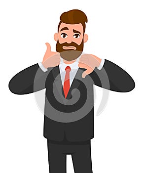 Young business man showing thumbs up and thumbs down gesture. Like and dislike. Agree and disagree.