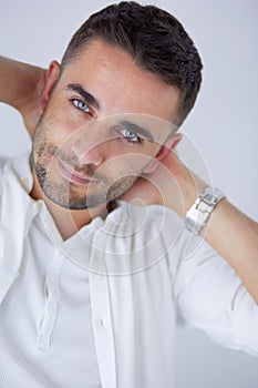 Young business man standing isolated on white background.