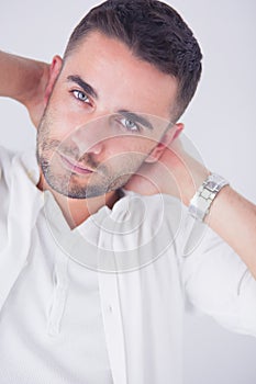 Young business man standing isolated on white background.