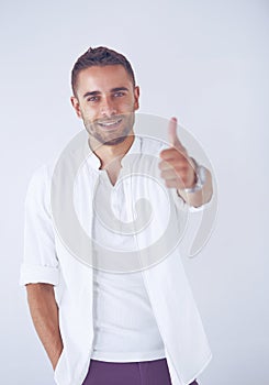Young business man standing isolated on white background