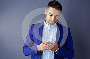 Young business man standing isolated on white background.