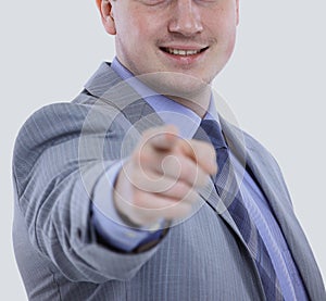 Young business man in a suit pointing with his finger