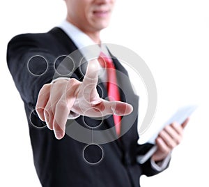 Young business man in a suit pointing with his finger