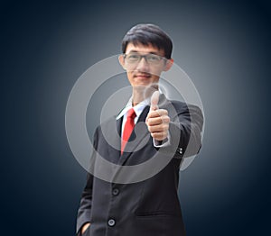 Young business man in a suit pointing with his finger