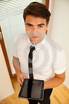 Young business man surfing the web on tablet