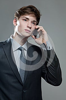 Young business man talking on cell phone