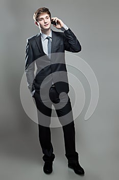 Young business man talking on cell phone