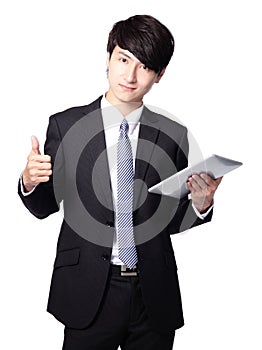 Young business man thumb up with touch pad