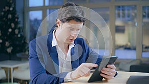 Young business man use modern device for reading