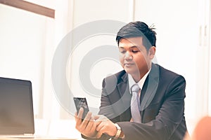 Young business man using smart phone