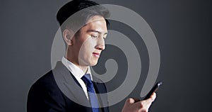 Young business man using the smart phone