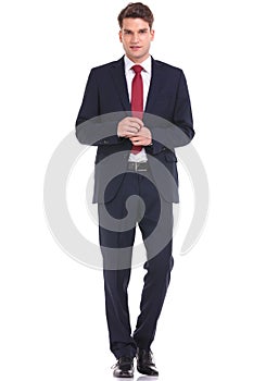 Young business man walking on isolated background.