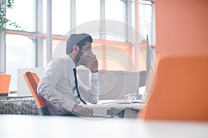 Young business man working on desktop computer