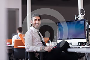 Young business man working on desktop computer