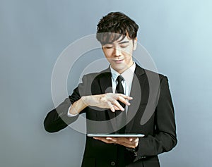 Young business man  working on digital tablet