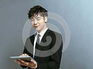 Young business man  working on digital tablet