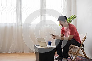 Young business man working at home with laptop