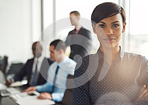 Young business owner in office with employees photo