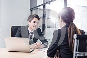 Young business people discussing in office