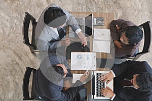 Young business people and entrepreneur having a meeting around t