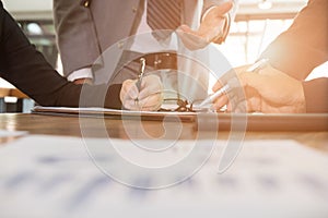 Young business people and entrepreneur working around table in o