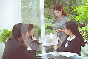 Young business people making meeting and talking for analyzing marketing working at office on desk.