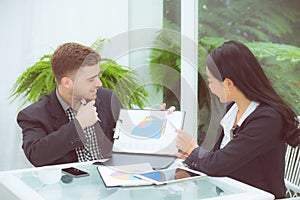 Young business people making meeting and talking for analyzing marketing working at office on desk.