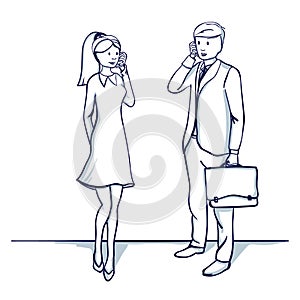 Young business people: a man and a woman are talking on the phone.