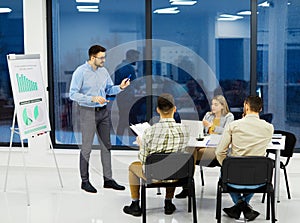 young business people meeting office teamwork group whiteboard presentation seminar man businessman startup project idea