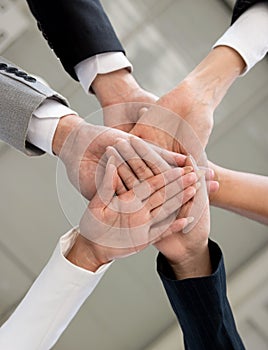 Young business people and office workers. Hand as a symbol