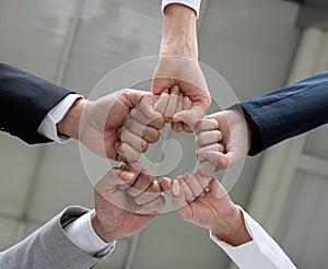 Young business people and office workers. Hand as a symbol