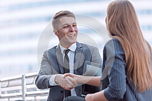 Young business people shaking hands at an informal meeting