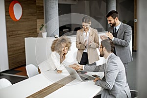 Group of young business people making a deal at a meeting in the office