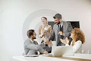 Group of young business people making a deal at a meeting in the office