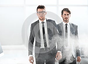 Young business people in a smoky office