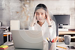 Young business people are suffering from headaches,Asian women S