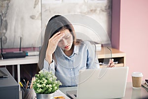Young business people are suffering from headaches,Asian women S