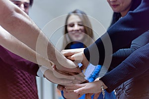 Young business people Teamwork Stacking Hand Concept. Close up of young  business people putting their hands together. Friendly