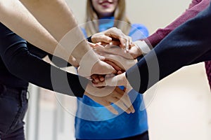 Young business people Teamwork Stacking Hand Concept. Close up of young  business people putting their hands together. Friendly