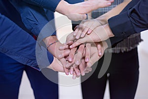 Young business people Teamwork Stacking Hand Concept. Close up of young  business people putting their hands together. Friendly